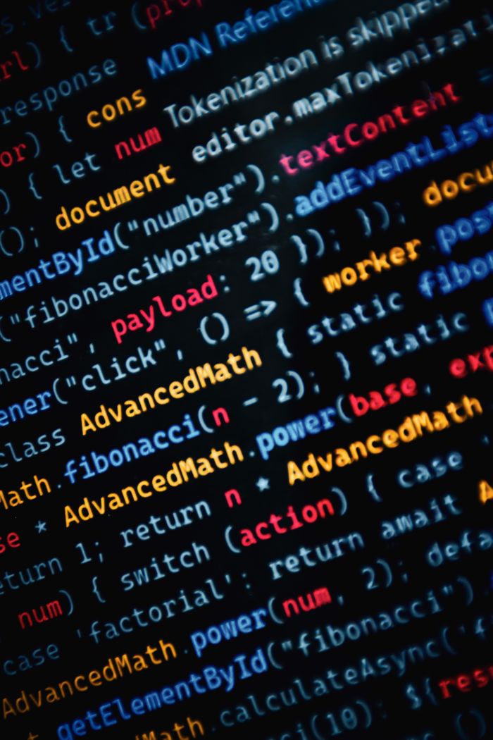 our-story Close-up of vibrant JavaScript code displayed on a monitor showcasing web development.
