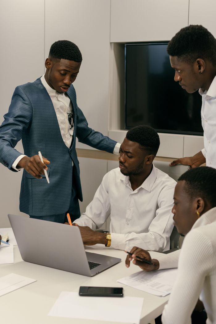 A diverse team engaged in a productive meeting in a modern office environment.